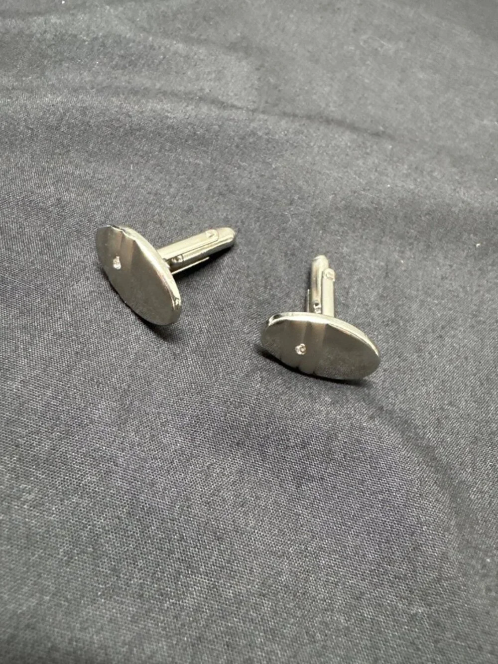 Silver Oval Cufflinks With Textured Back & Single Diamond Accent For Men